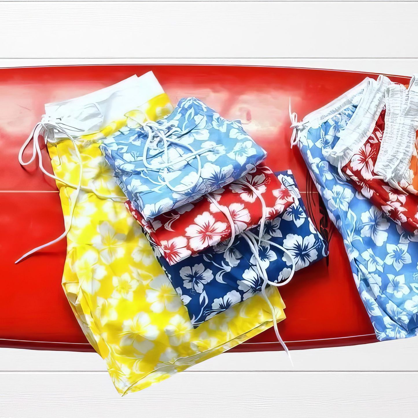 Men's long swim briefs with hibiscus print.