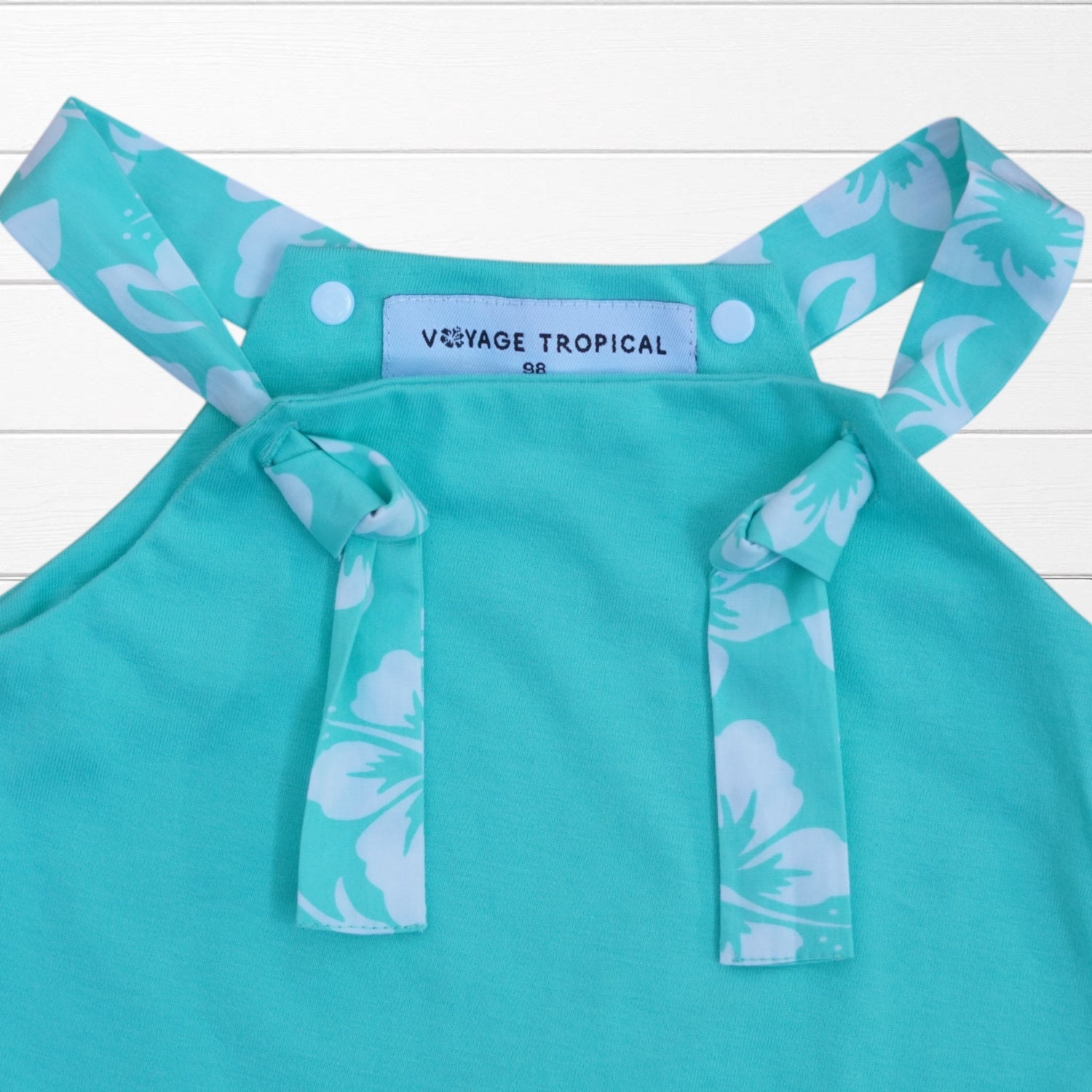 Combinaison bébé unie biais imprimé hibiscus